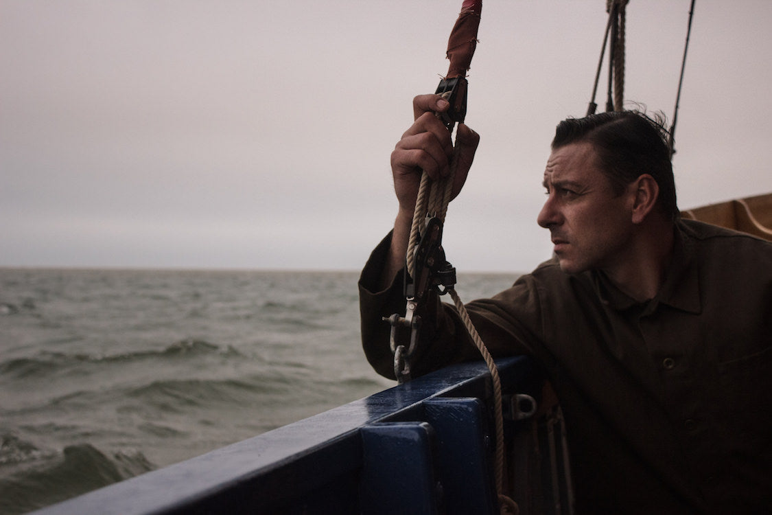 Man on a boat wearing British Aftershave