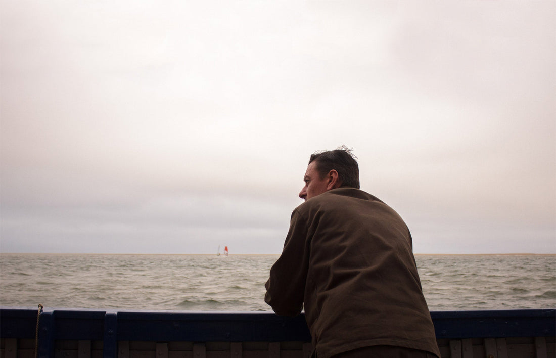 Man leaning on a boat