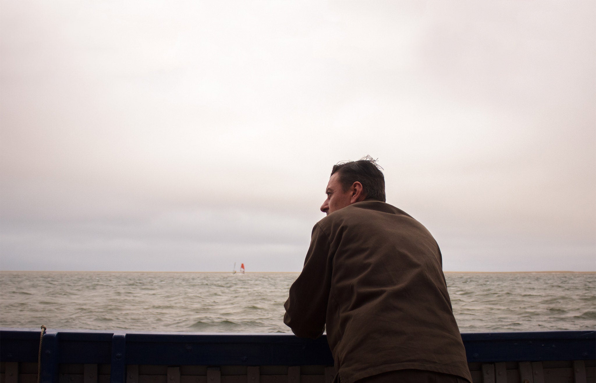 Man leaning on a boat